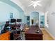 Bright home office featuring built-in shelving, hardwood floors, and an oversized wooden desk at 450 Bayshore Dr, Terra Ceia, FL 34250