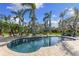 Inviting outdoor swimming pool with a lush tropical landscape at 450 Bayshore Dr, Terra Ceia, FL 34250