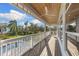 Expansive porch overlooking a lush backyard with a pool, perfect for outdoor relaxation and enjoyment at 450 Bayshore Dr, Terra Ceia, FL 34250
