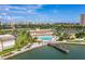 Aerial view of the community with pool, lake, and well-manicured landscaping at 4900 Brittany S Dr # 1706, St Petersburg, FL 33715