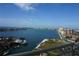 Expansive balcony view showing waterfront homes, a park, a bridge and sparkling blue water, and city skyline at 4900 Brittany S Dr # 1706, St Petersburg, FL 33715