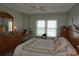 Bedroom with a large bed, window view, and neutral colored wall paint at 4900 Brittany S Dr # 1706, St Petersburg, FL 33715