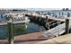 Dock featuring a boat lift and boat, with waterfront views at 4900 Brittany S Dr # 1706, St Petersburg, FL 33715