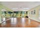 Bright exercise room with mirrors, wood floors, and natural light at 4900 Brittany S Dr # 1706, St Petersburg, FL 33715