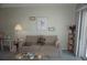 Cozy living room featuring comfortable seating, decor, and view of the balcony at 4900 Brittany S Dr # 1706, St Petersburg, FL 33715