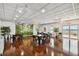 Well-lit meeting room features wood floors, stylish decor, tables, and beautiful views at 4900 Brittany S Dr # 1706, St Petersburg, FL 33715