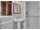 Charming bathroom featuring a pedestal sink, shower, and bright natural light at 505 27Th N Ave, St Petersburg, FL 33704
