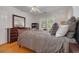 Relaxing bedroom features bright natural light, a ceiling fan, and wood flooring at 505 27Th N Ave, St Petersburg, FL 33704