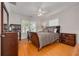 Cozy bedroom offers wood floors, a ceiling fan, and closet space at 505 27Th N Ave, St Petersburg, FL 33704