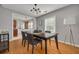 Dining room featuring stylish lighting, hardwood floors, and a view to the kitchen at 505 27Th N Ave, St Petersburg, FL 33704