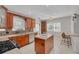 Updated kitchen offers stainless appliances, tile backsplash, shaker cabinets, and a center island at 505 27Th N Ave, St Petersburg, FL 33704