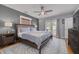Spacious bedroom boasts a ceiling fan, ensuite bathroom, and a door leading outside at 505 27Th N Ave, St Petersburg, FL 33704