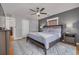 Relaxing main bedroom offers generous space, an accent wall, and wood flooring at 505 27Th N Ave, St Petersburg, FL 33704