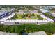 Aerial view showcasing the layout of a community, featuring a central courtyard, pool, and mature trees at 5080 Locust Ne St # 321, St Petersburg, FL 33703