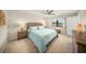 Cozy bedroom with a ceiling fan, plush carpet, and stylish, matching furnishings at 5080 Locust Ne St # 321, St Petersburg, FL 33703