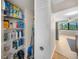 Walk-in pantry features shelving stocked with various household supplies and cleaning products at 5080 Locust Ne St # 321, St Petersburg, FL 33703