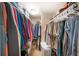 Organized walk-in closet featuring ample hanging space and shelving for optimal storage solutions at 5080 Locust Ne St # 321, St Petersburg, FL 33703