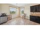 Bright breakfast nook featuring tiled flooring, a sunny window, and granite countertops near kitchen at 627 Washita Stone Dr, Ruskin, FL 33570