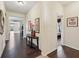 Inviting foyer with dark hardwood flooring, neutral walls, and decorative accents, creating a warm ambiance at 627 Washita Stone Dr, Ruskin, FL 33570