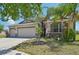 Charming single-Gathering home with a three-car garage, well-manicured lawn, and inviting curb appeal at 627 Washita Stone Dr, Ruskin, FL 33570