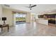 Open concept kitchen with granite countertops, stainless steel appliances, and adjacent dining area at 627 Washita Stone Dr, Ruskin, FL 33570