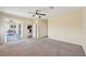 Bright living room with tile floors, ceiling fan, and access to a screened lanai at 627 Washita Stone Dr, Ruskin, FL 33570