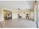 Open living area with neutral tones, tile flooring, and sliding door access to the outdoors at 627 Washita Stone Dr, Ruskin, FL 33570
