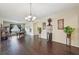 Elegant living room featuring dark hardwood floors, billiard table, and stylish decor at 627 Washita Stone Dr, Ruskin, FL 33570