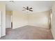 Spacious main bedroom with neutral walls, carpet, and a ceiling fan for added comfort at 627 Washita Stone Dr, Ruskin, FL 33570