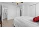 Bright bedroom with mirrored closet, neutral paint, tile floor and attached bathroom at 6414 Larmon St, Tampa, FL 33634