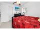 Modern bedroom features ceramic tile flooring, neutral paint, and ample natural light at 6414 Larmon St, Tampa, FL 33634