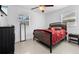 Cozy bedroom features ceramic tile flooring, modern furnishings, and ample natural light at 6414 Larmon St, Tampa, FL 33634