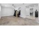 Large bonus room with tiled flooring, neutral walls, and adjacent access to multiple rooms at 6414 Larmon St, Tampa, FL 33634