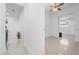 Bright hallway with tile floors leading to rooms; seamless passage between rooms and living spaces at 6414 Larmon St, Tampa, FL 33634