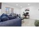Contemporary living room features sleek flooring, lots of natural light, and stylish seating at 6414 Larmon St, Tampa, FL 33634