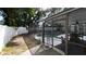 Backyard screened-in pool with outdoor seating area perfect for enjoying summer days at 6414 Larmon St, Tampa, FL 33634