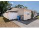 Exterior side view showing white privacy fence and easy access to trash receptacle at 6414 Larmon St, Tampa, FL 33634