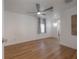 Inviting bedroom boasts wood floors, a ceiling fan, and natural light, providing a comfortable and stylish retreat at 7006 N Duncan Ave, Tampa, FL 33604