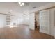 Renovated bedroom showcasing barn door to bath, laminate floors, and fresh paint at 7006 N Duncan Ave, Tampa, FL 33604