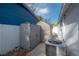 Backyard showing two storage sheds, an air conditioning unit, and brick pavers at 7006 N Duncan Ave, Tampa, FL 33604
