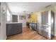 Modern kitchen with stainless steel appliances and sleek gray cabinetry at 7006 N Duncan Ave, Tampa, FL 33604