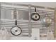 Close-up of a modern pot rack with hanging pots and utensils at 7006 N Duncan Ave, Tampa, FL 33604