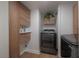 Efficient laundry room with modern washer and dryer units, along with ample storage space, maximizing functionality at 7006 N Duncan Ave, Tampa, FL 33604