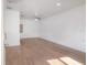 Bright living room showcasing new laminate floors and freshly painted walls at 7006 N Duncan Ave, Tampa, FL 33604