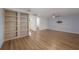 Bright and airy living room with beautiful wood floors and newly constructed shelving at 7006 N Duncan Ave, Tampa, FL 33604