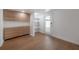 Stylish living room boasts modern cabinetry, floating shelves, and an exit door leading to the outdoors at 7006 N Duncan Ave, Tampa, FL 33604