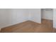 A bright living room featuring wood floors and white walls that creates a modern, minimalist atmosphere at 7006 N Duncan Ave, Tampa, FL 33604