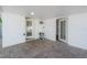 View of the covered patio area featuring a paved ground and exits with plants at 7006 N Duncan Ave, Tampa, FL 33604