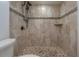 Stylish shower with designer tile, mosaic accents, and modern showerhead at 7006 N Duncan Ave, Tampa, FL 33604