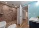 Walk-in shower showcasing elegant tile work and a built-in niche, offering a luxurious and spa-like experience at 7006 N Duncan Ave, Tampa, FL 33604